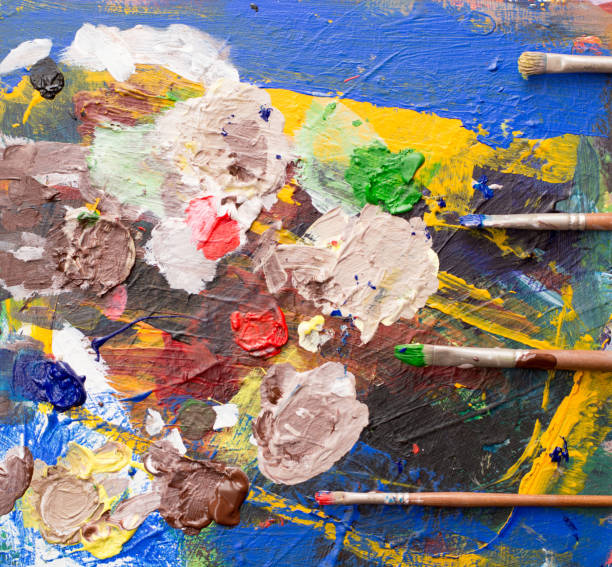 istock Mixing paint on the painting palette 1860445949