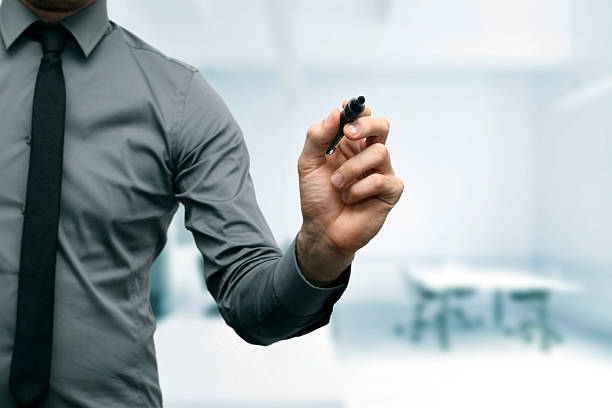 istock businessman with black marker in the hand 186044810