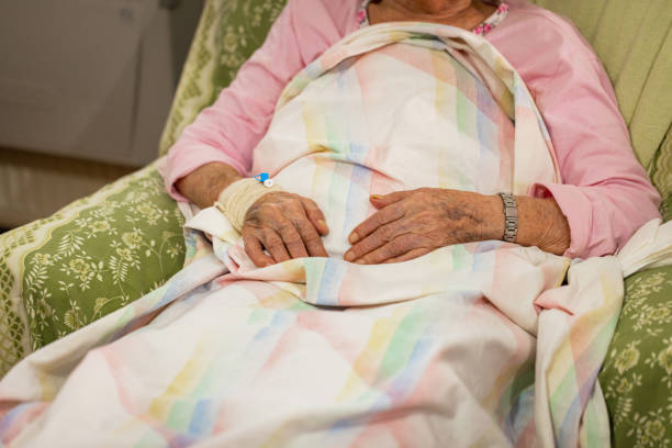 istock Elderly Patient's Hand with Medical Cannula 1860453145