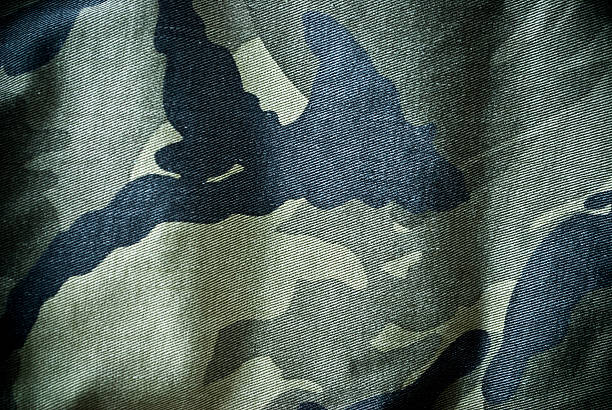 Green and black camouflage material background or texture