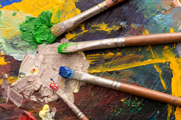 istock Mixing paint on the painting palette 1860463931