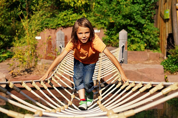 Boy on a bridge stock photo