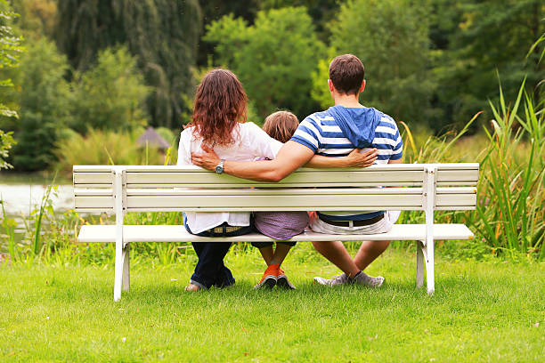 istock family on park bench 186048981