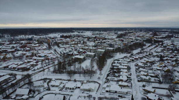 istock White, Snowy Streets and Sidewalks on a Cold Cloudy Winter's Day 1860504387