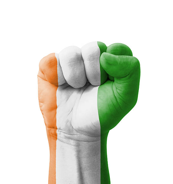 istock Fist of Ivory Coast flag painted, multi purpose concept 186052009
