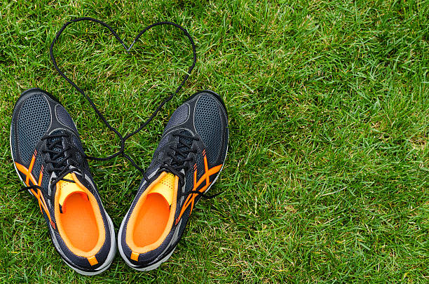 istock Sneakers on grass with heart 186052795