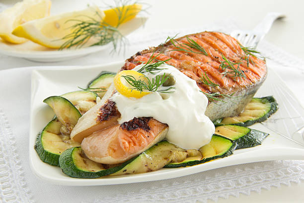 istock Salmon fried on a grill with zucchini. 186053210