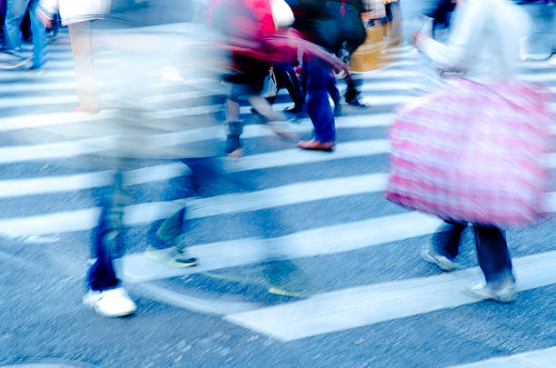 istock people crowd on zebra crossing street 186053271