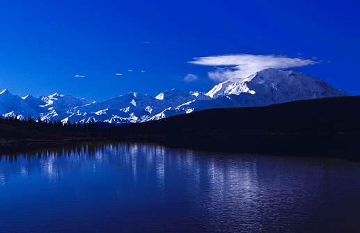 Distant view of Mount Denali, as seen from across Wonder Lake.

Taken from Denali National Park, Alaska, USA