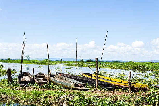 istock fisherman boat at a shore,Sakon Nahkon,Thailand. 186055753