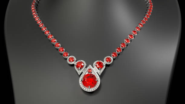 istock Gold ruby diamond teardrop necklace on a black jewelry bust 1860588293