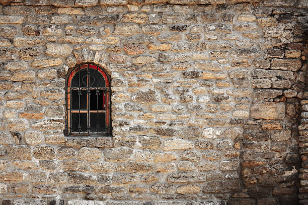 Old wall from the Jerusalem stone and window with lattice window