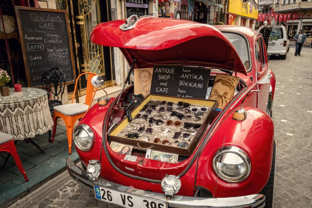 istanbul balat area, old red car parked on the street selling sun glasses at balat district, istanbul, turkey - balat stok fotoğraflar ve resimler