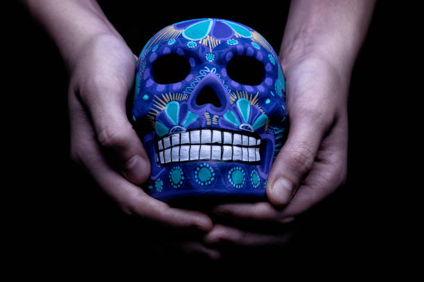 Skull These painted skulls are very common in Mexico, and they show deep respect for the dead. skeloton hand stock pictures, royalty-free photos & images