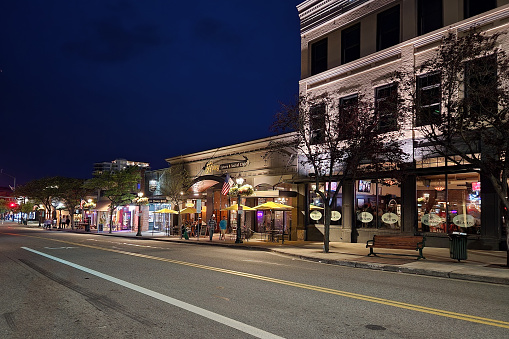 Coeur d'Alene, Idaho - June 17, 2022 - Street scene in city's downtown commercial area at night.