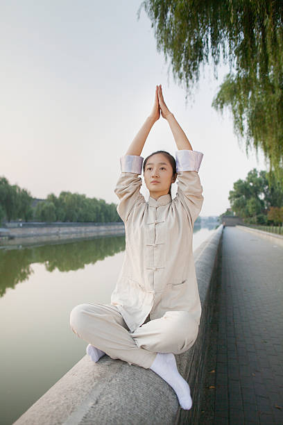 istock Young Woman Practicing Tai Ji 186061550