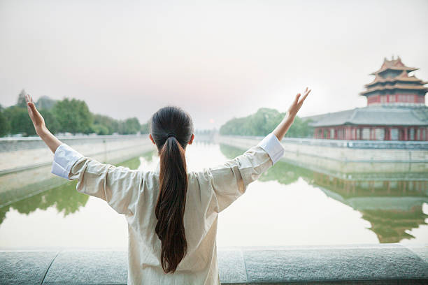 istock Young Woman Practicing Tai Ji 186061558
