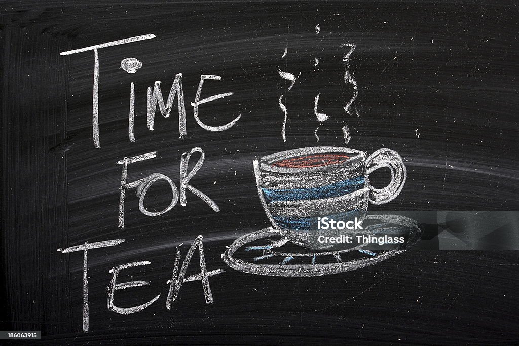 Time For Tea A blackboard sign with the words Time For Tea and a cup of hot tea on a saucer Chalk Drawing Stock Photo