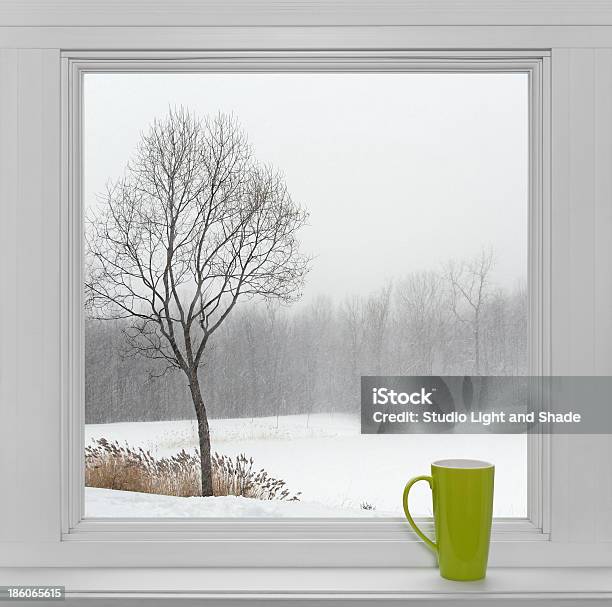 Winter Landscape Seen Through The Window And Green Cup Stock Photo - Download Image Now