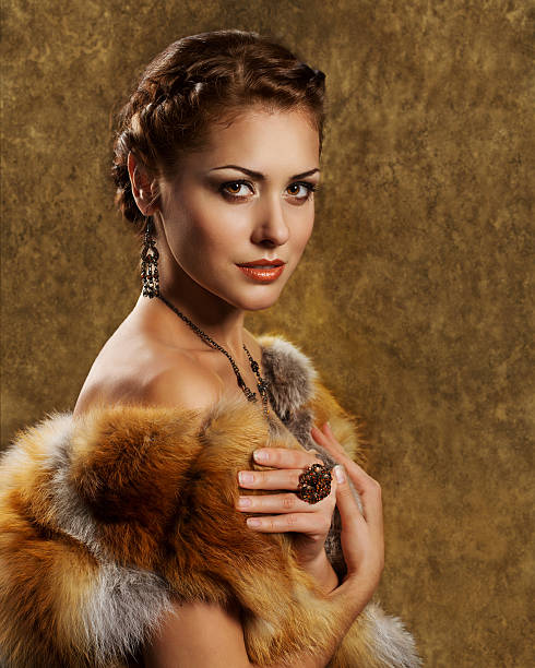 istock Woman in luxury golden fox fur coat 186065628