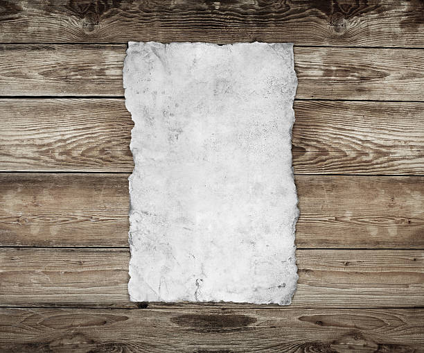 istock Old paper on the wood background 186066242