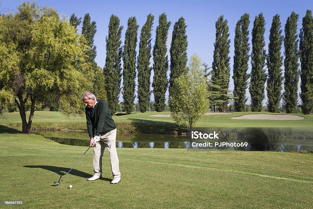 Senior man on golf course Senior man on golf course prepare to shot 70-79 Years Stock Photo