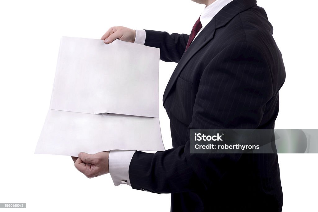 blank newspaper businessman holding a blank news paper isolated on white Adult Stock Photo