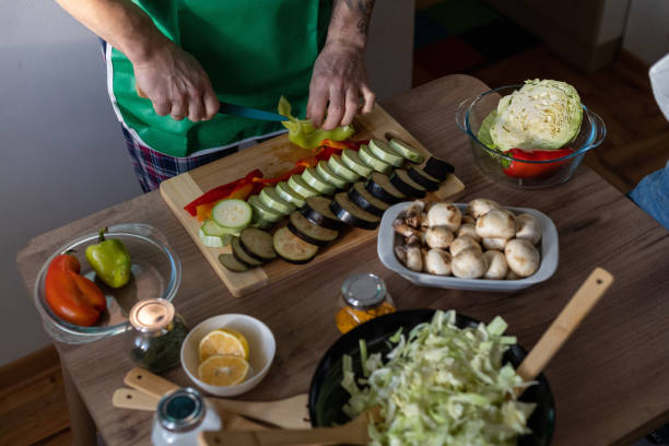 istock A man is preparing a healthy vegan dinner. 1860694066