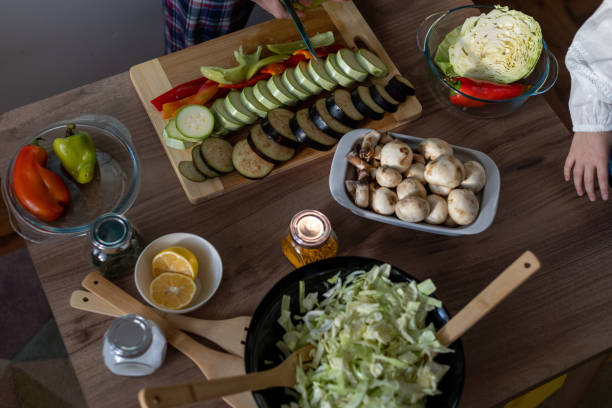 istock Table scene with nutritious vegetables, pices, and mushrooms. 1860694581