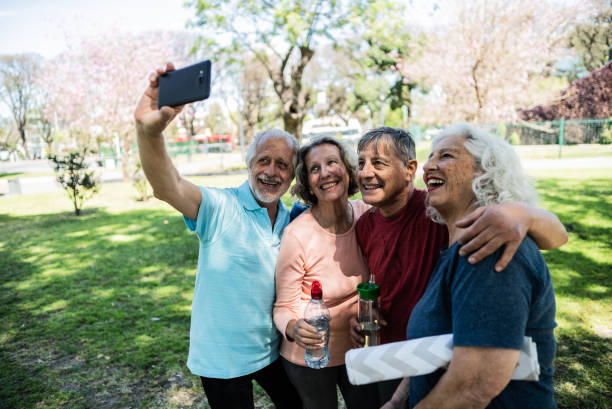 istock Senior friends taking a selfie on the public park 1860698246
