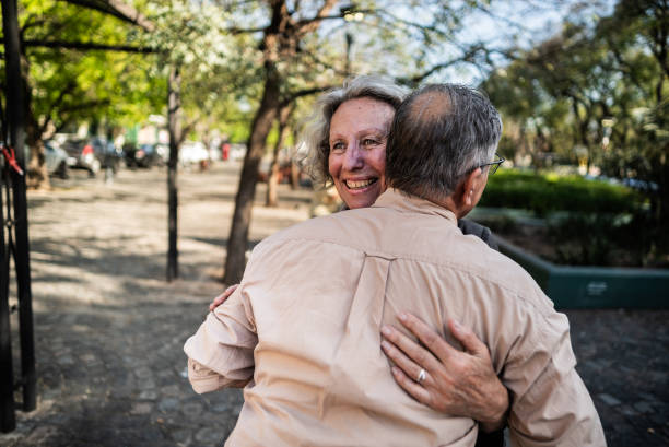 istock Senior friends embracing outdoors 1860703039