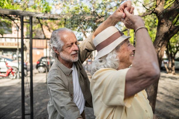 istock Senior couple dancing outdoors 1860703448