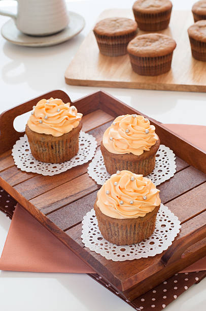 Homemade cupcakes served on kitchen table. stock photo