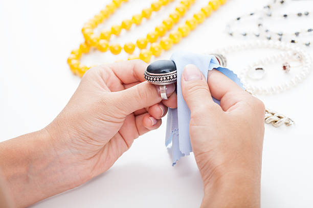 istock Polishing silver jewellery with a cloth 186071359