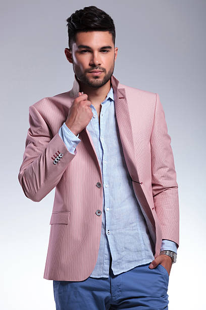 istock casual man with hand on lapel and in pocket 186072588