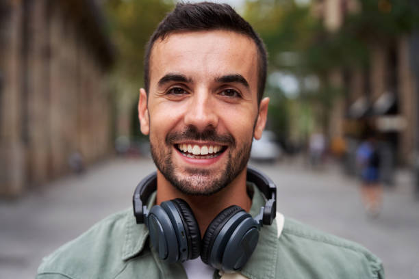istock Portrait of a young handsome man smiling and looking at camera. 1860736833