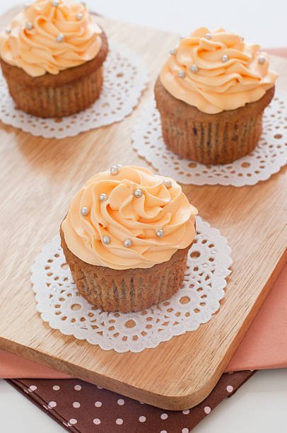 Homemade cupcakes served on kitchen table. stock photo