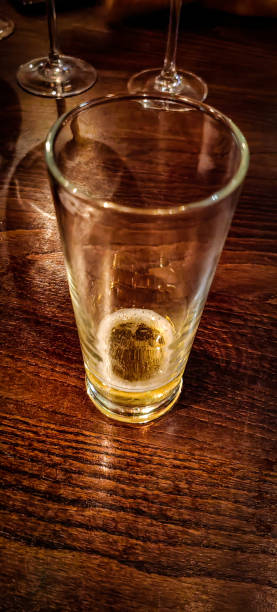 istock Almost empty glass of beer 1860790333