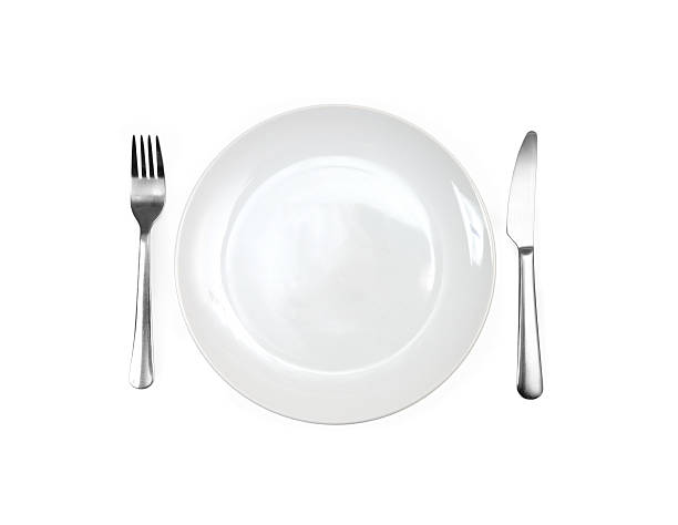 istock Close up of a diner plate with fork and spoon 186081279