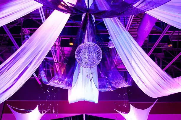 Reception decoration beautifully lit with purple lighting.