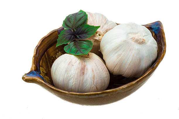 Ripe garlic Ripe garlic with basil leaf acrid taste stock pictures, royalty-free photos & images