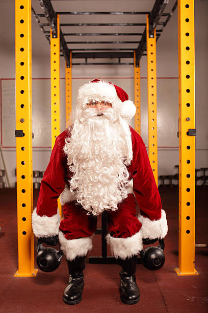istock Santa Claus training before Christmas in gym - kettlebells 186082222