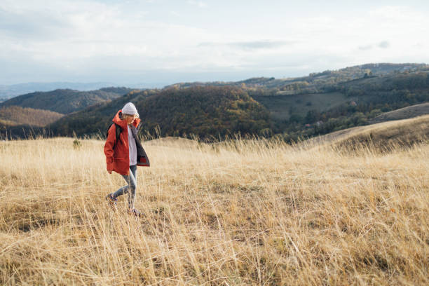 Healthy lifestyle outdoors: a young woman enjoying herself in nature.
