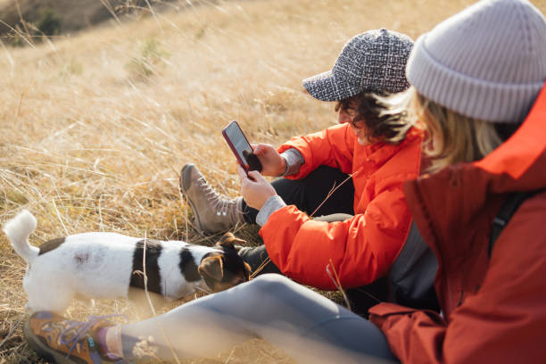 istock Friends on a Happy Hike Use a Mobile Phone 1860828128