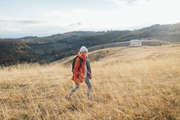 Healthy lifestyle outdoors: a young woman enjoying herself in nature.