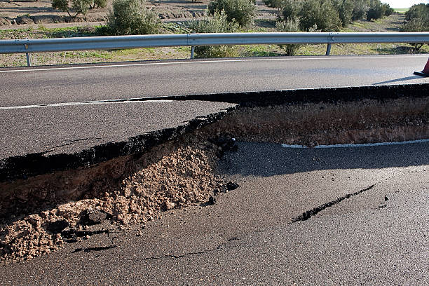 istock Asphalt road with a crack caused by landslides 186083591