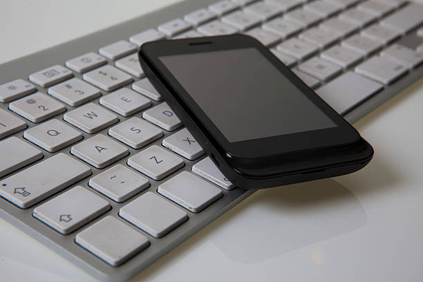 istock Business concept - smartphone and keyboarda 186085494