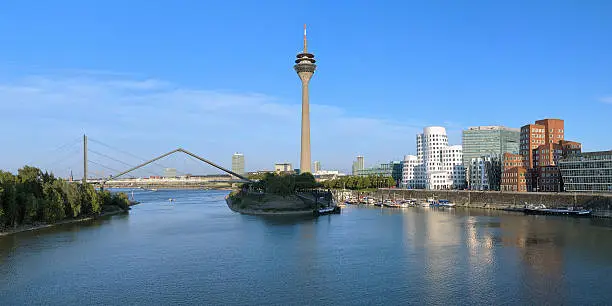 Panorama of the Media Harbor in Dusseldorf with Rheinturm TV tower and Buildings of Neuer Zollhof, Germany