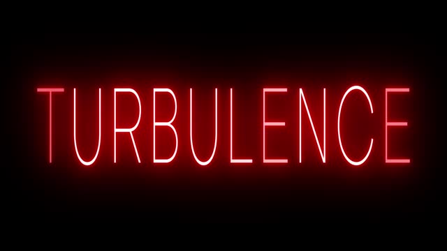 Glowing and blinking red retro neon sign for TURBULENCE
