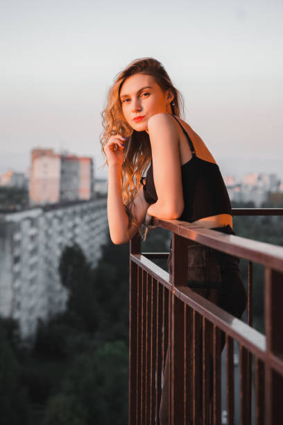 istock Woman in balcony 1860867675